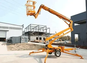 Towable boom lifts